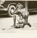 Man sitting on the side of road