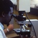 Looking through a microscope