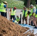 Volunteers work during the National Association of Landscape Professionals’ 19th annual Renewal and Remembrance at Arlington National Cemetery