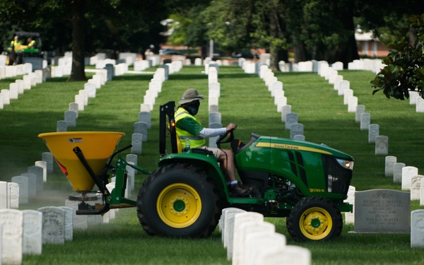 Volunteers work during the National Association of Landscape Professionals’ 19th annual Renewal and Remembrance at Arlington National Cemetery