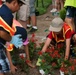 Volunteers work during the National Association of Landscape Professionals’ 19th annual Renewal and Remembrance at Arlington National Cemetery