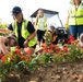 Volunteers work during the National Association of Landscape Professionals’ 19th annual Renewal and Remembrance at Arlington National Cemetery