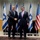 Secretary of defense and Israel's minister of defense shake hands