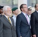 Secretary of defense and Israel's minister of defense stand at attention