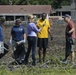 Sailors assist in a cleanup at the ancient fishpond, Loko Pa’aiau, on Oahu