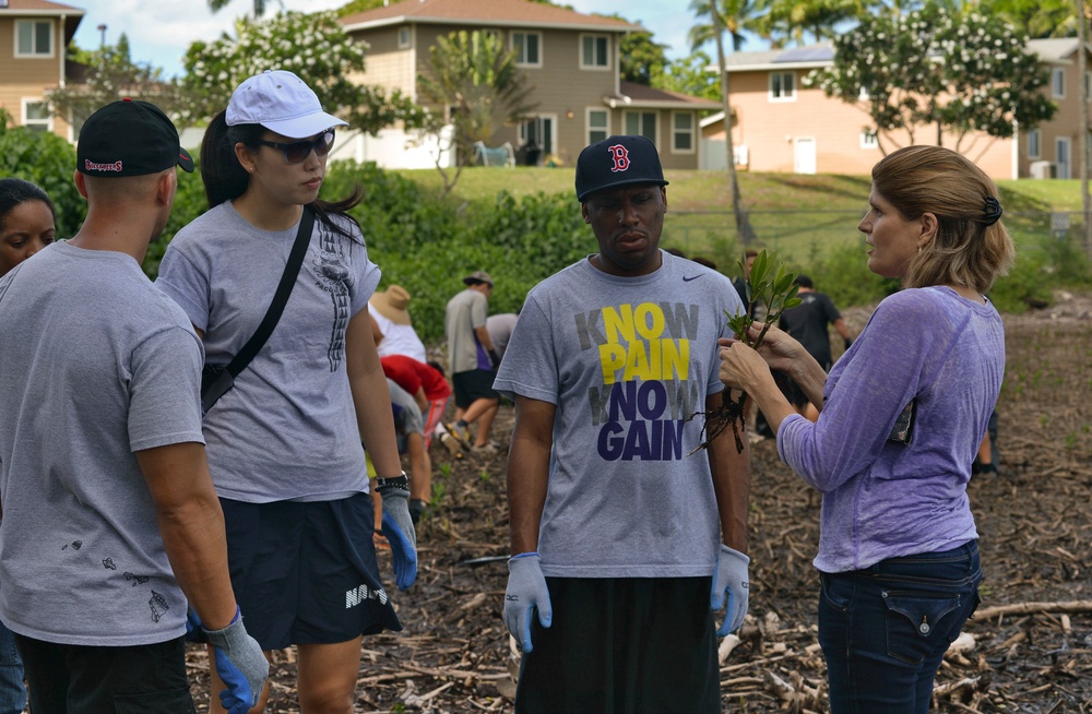 Sailors assist in a cleanup at the ancient fishpond, Loko Pa’aiau, on Oahu