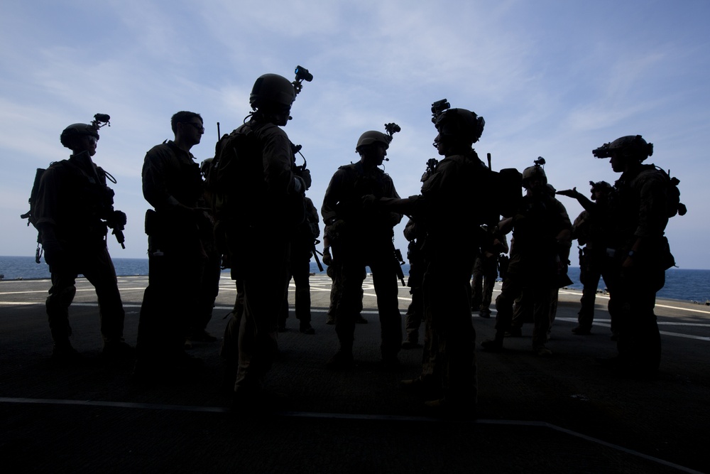 Force Recon Marines practice taking over ships at sea