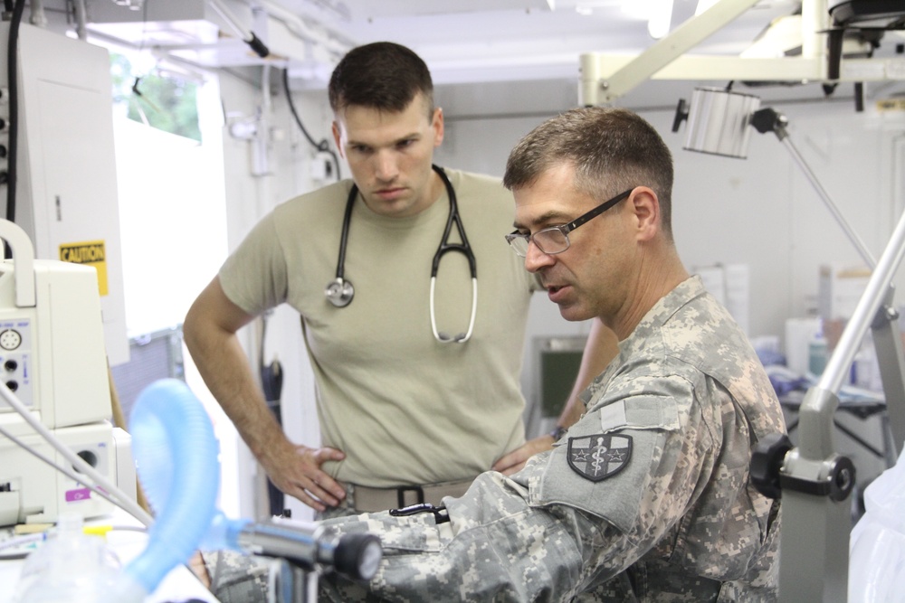 Service members inspect equipment prior to surgery at IRT in Norwich, NY