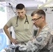 Service members inspect equipment prior to surgery at IRT in Norwich, NY