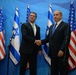Secretary of defense and Israel's PM shake hands