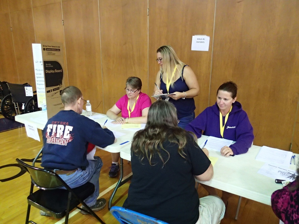 Volunteers check-in patients during IRT mission in Norwich, NY