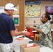 Service member provides medication to patients during IRT mission in Norwich, NY