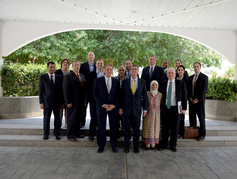 Secretary of defense poses for a photo with United States consulate personnel