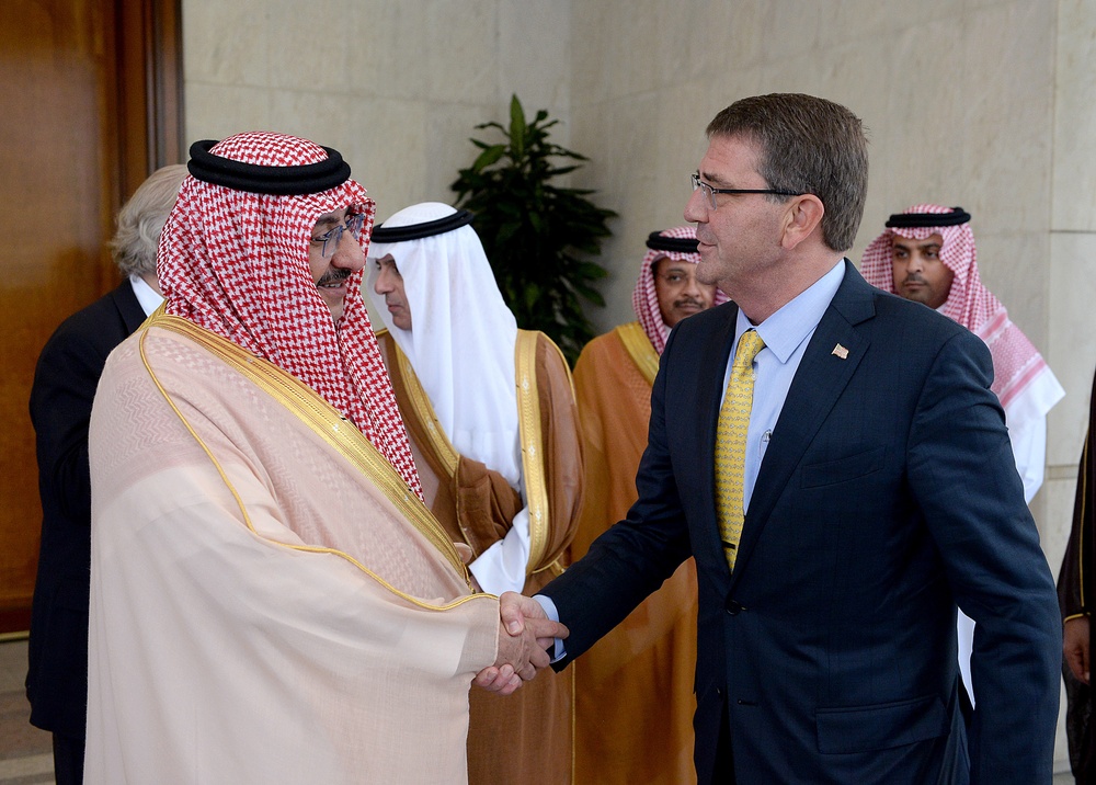 Secretary of defense shakes hand with king of Saudi Arabia