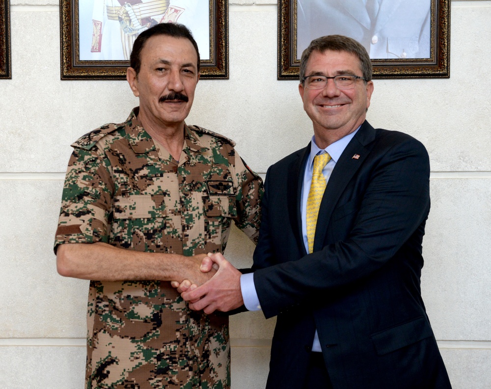 Secretary of defense shakes hands with Gen. Mash'al Mohammad al Zaben