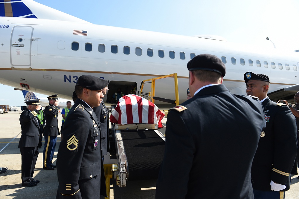 Army Reserve soldiers conduct a plane-side honor for fallen soldier