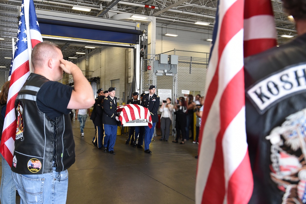 Army Reserve soldiers conduct a plane-side honor for fallen soldier