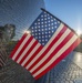 American flag at Vietnam Memorial wall