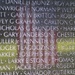 American flag reflected in the Vietnam Veterans Memorial wall