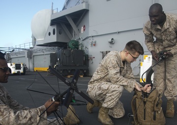 U.S. Marines perform radio checks at sea