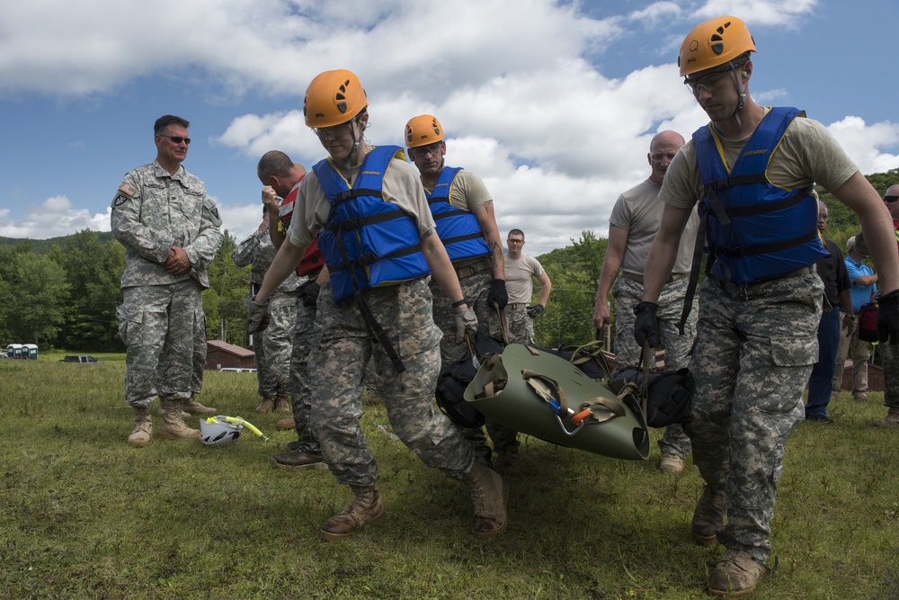 Soldiers hoist floating litters