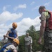 Soldiers hoist floating litters