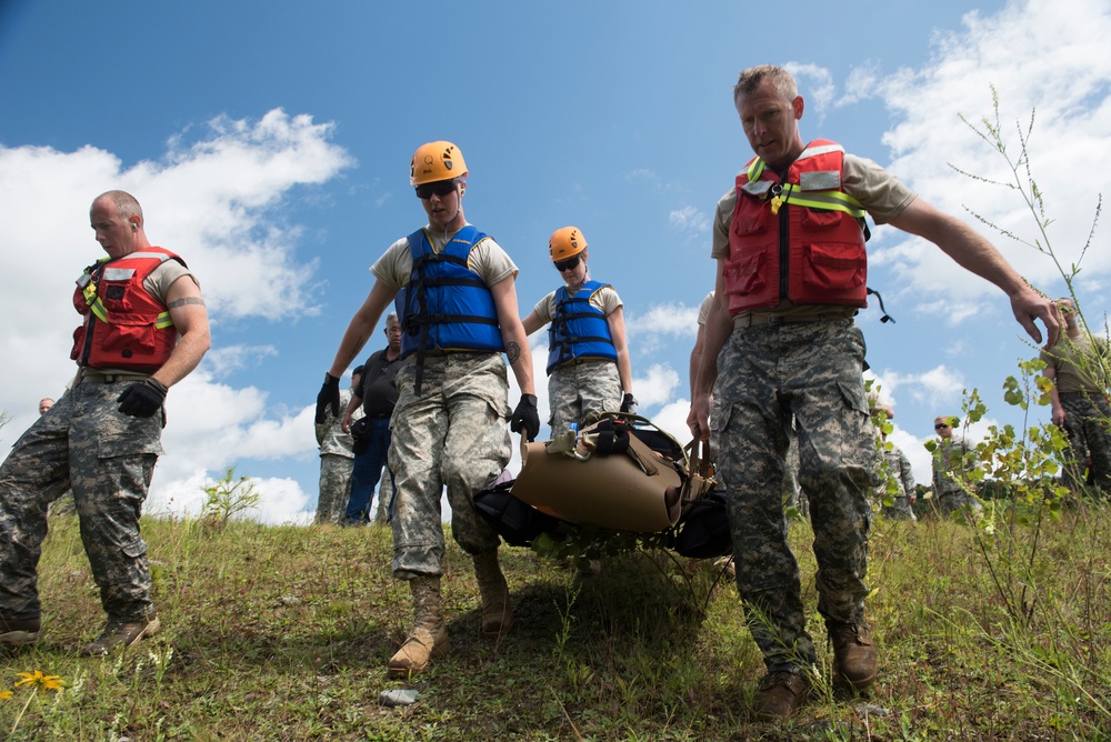 Soldiers hoist floating litters