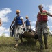 Soldiers hoist floating litters