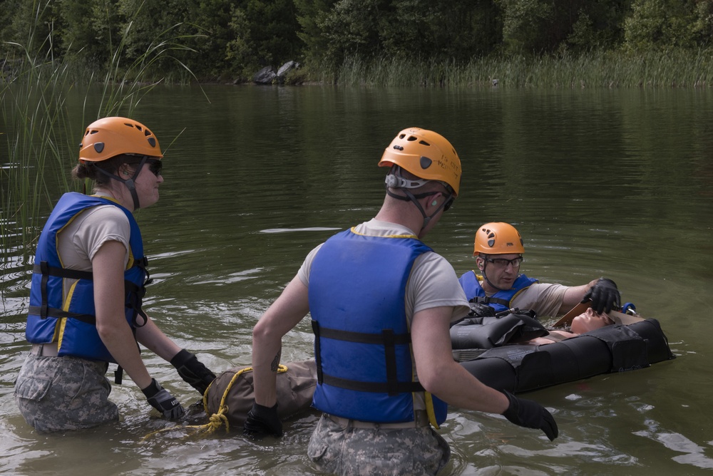 Soldiers hoist floating litters
