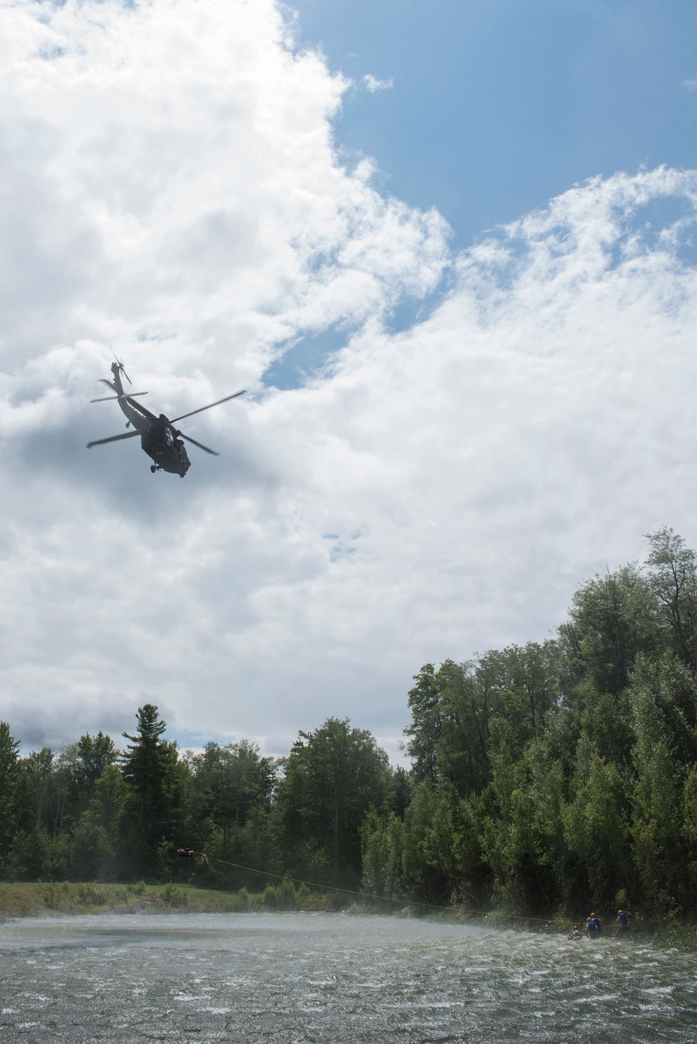 Soldiers hoist floating litters