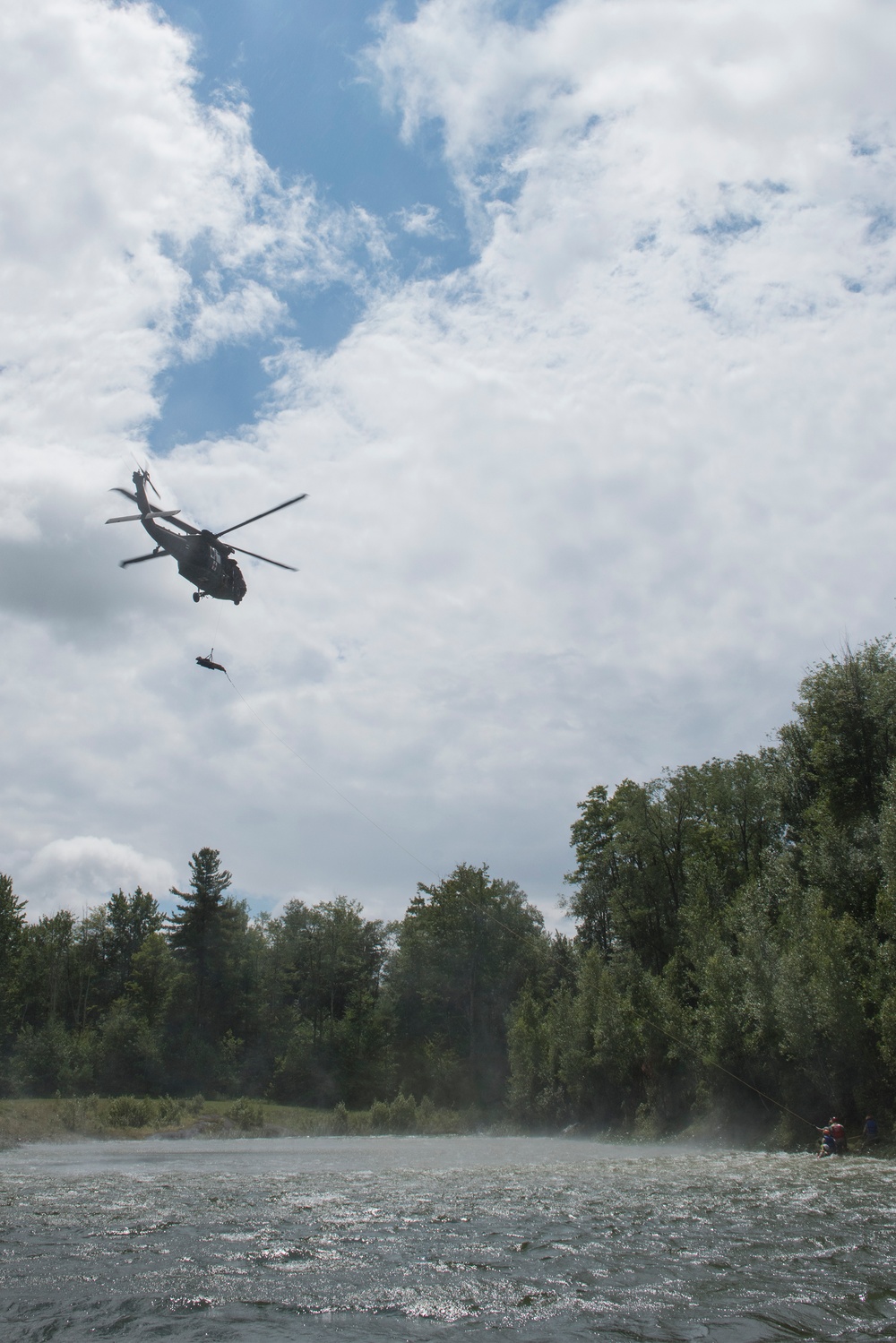 Soldiers hoist floating litters