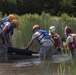Soldiers hoist floating litters