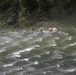 Soldiers hoist floating litters