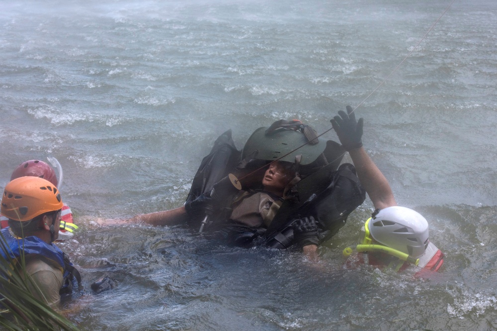 Soldiers hoist floating litters