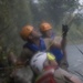 Soldiers hoist floating litters