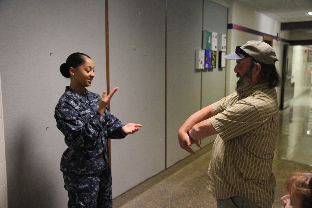 Service member uses sign language to communicate during IRT in Norwich, NY