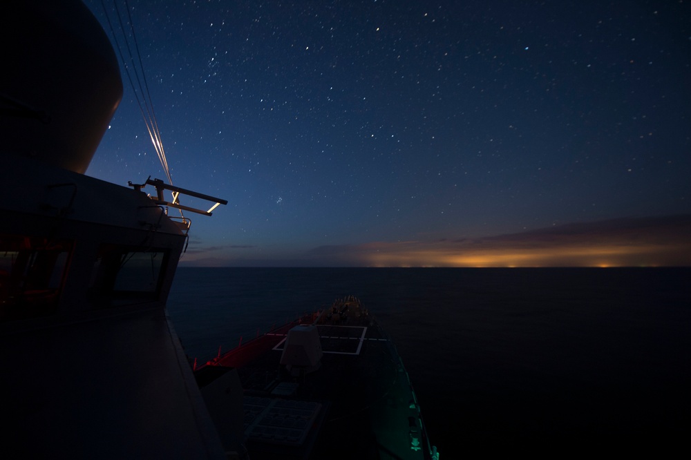 USS Jason Dunham operates at night in the Baltic