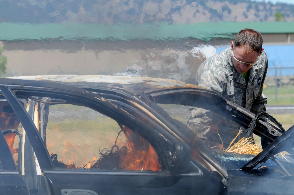 Kingsley Field Fire Department responds to a burning car during a training exercise