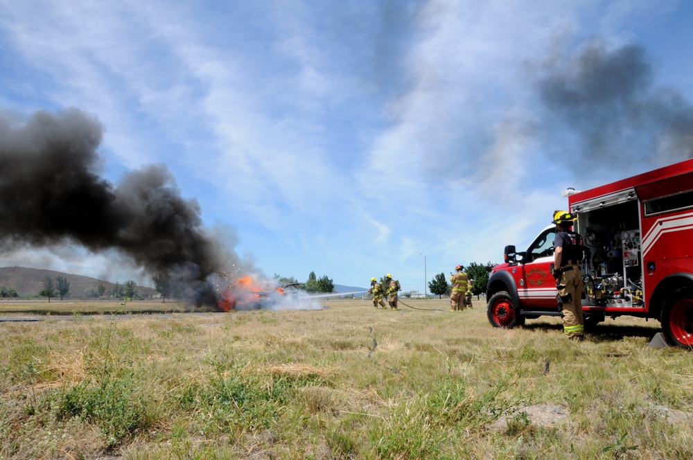 Kingsley Field Fire Department responds to a burning car during a training exercise.