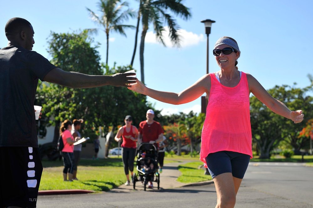 ‘Up, up and away’ they go during Pearl Harbor Super Hero 10K
