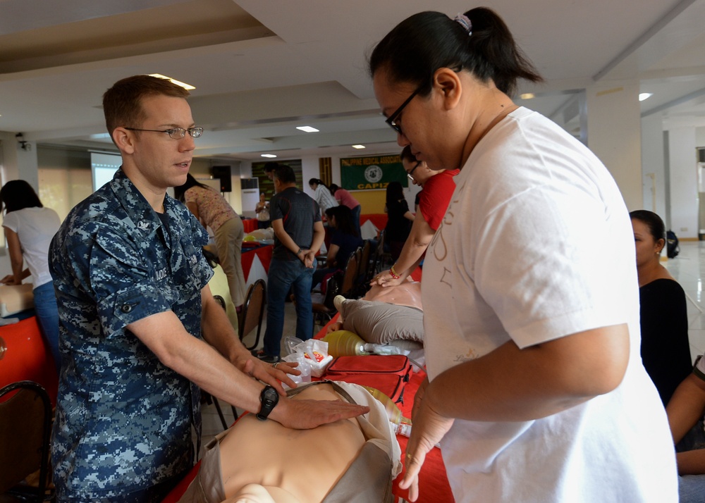 Mercy Sailors teach a Basic Life Support class in Roxas City, Philippines during Pacific Partnership 2015.