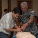 Mercy Sailors teach a Basic Life Support class in Roxas City, Philippines during Pacific Partnership 2015.