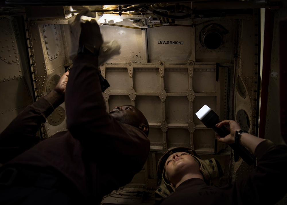 Sailors perform routine maintenance