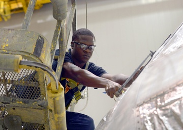 Warner Robins Air Logistics Complex employees ensure aircraft are sealed, corrosion free