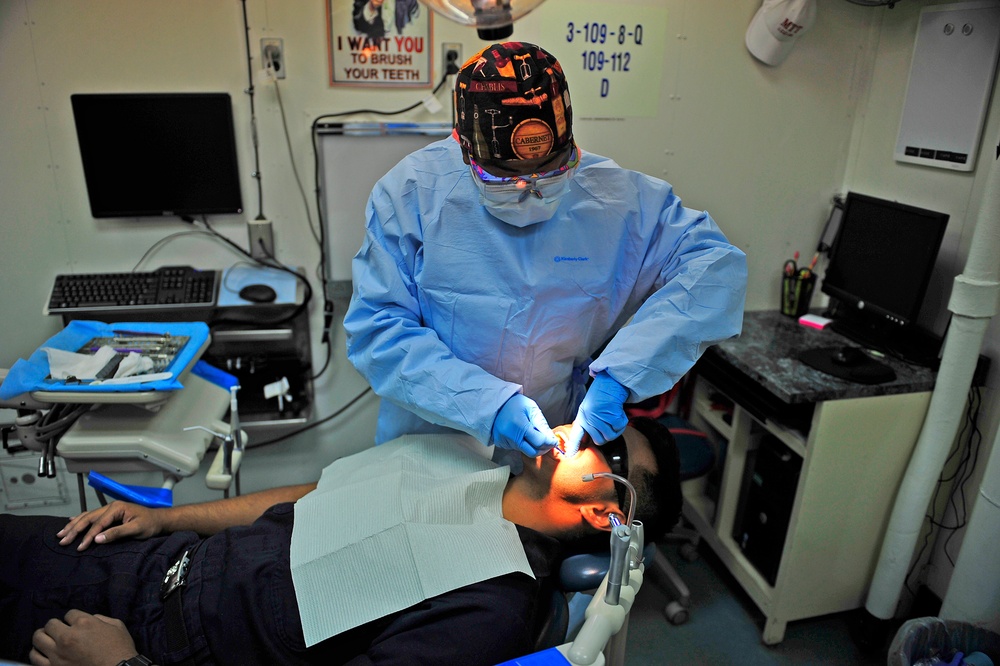 USS Blue Ridge Sailor receives dental cleaning