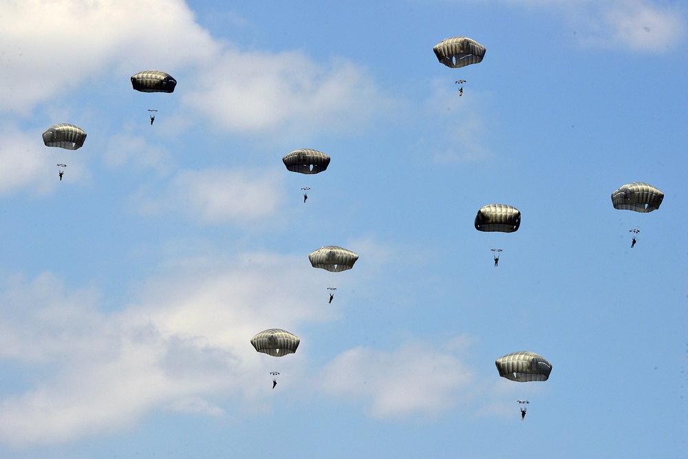 Paratroopers from the 173rd Airborne Brigade, conduct a multinational airborne operation with NATO allies at Juliet Drop Zone in Pordenone, Italy, July 10, 2015.