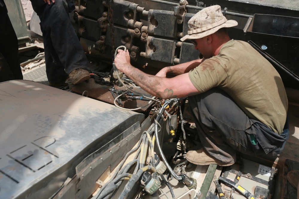 U.S. Marines repair M1A1 Abrams tanks