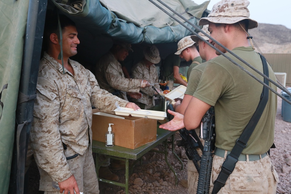 U.S. Marines enjoy a hot meal