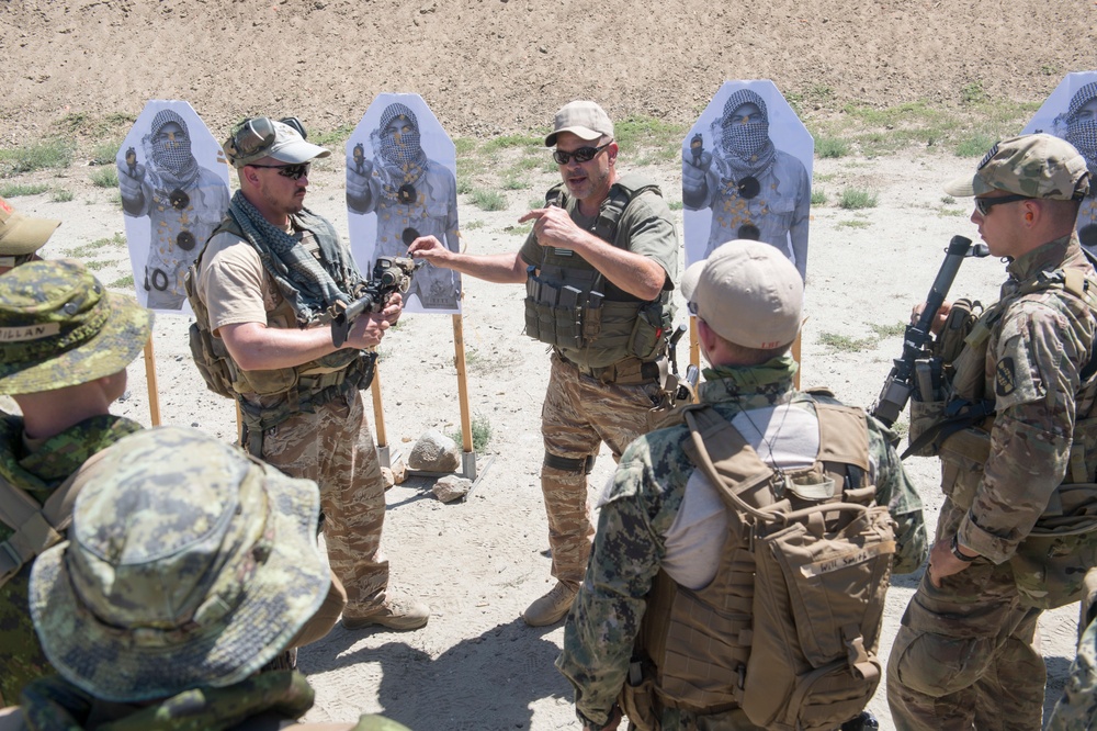 US and Canadian military combat cameramen train in combat tactics