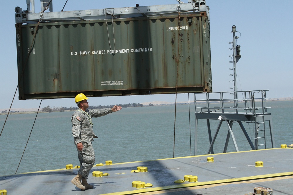 441st Transportation Company (Seaport Operations), directs the movement of a cargo container